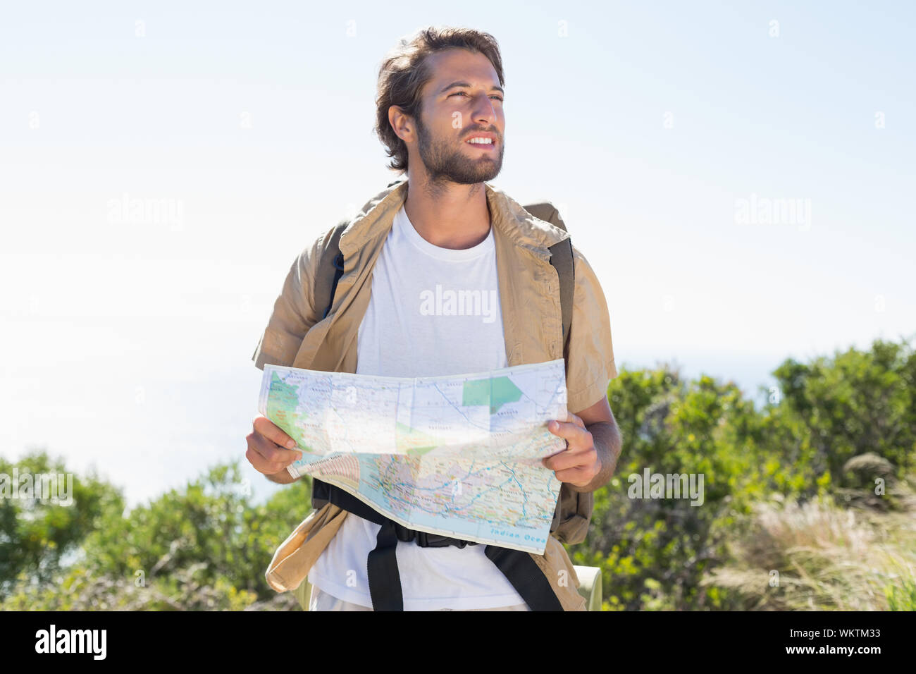 Handsome hiker holding map mountain hi-res stock photography and images ...