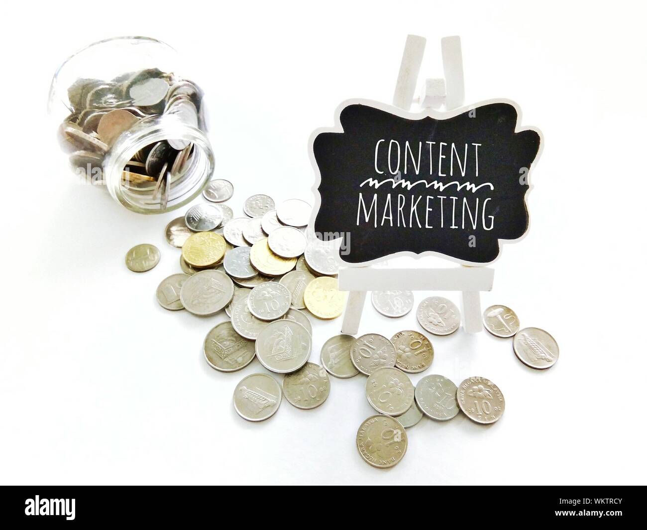 Content Marketing Text With Coins On White Background Stock Photo