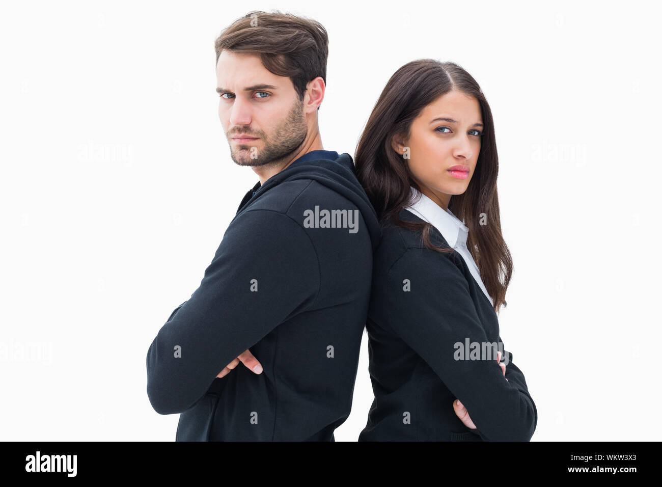 Unhappy couple not speaking to each other on white background Stock Photo