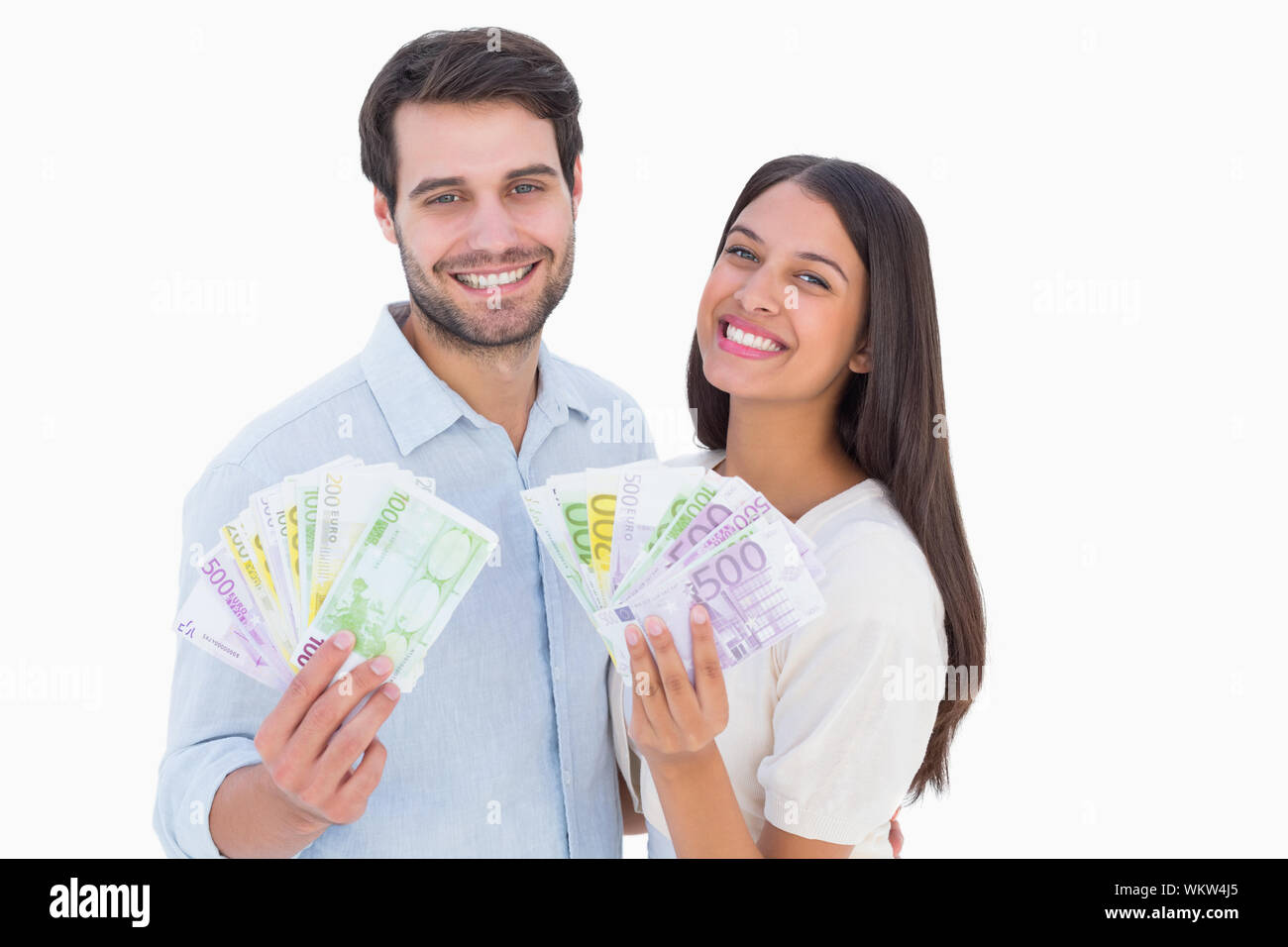 Happy couple showing their money on white background Stock Photo - Alamy