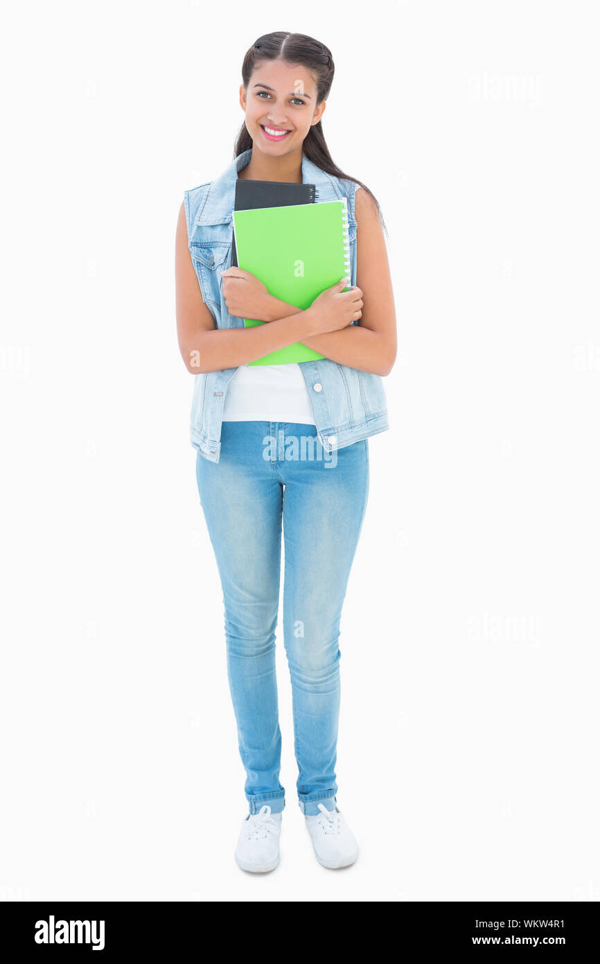 Pretty student smiling at camera on white background Stock Photo - Alamy