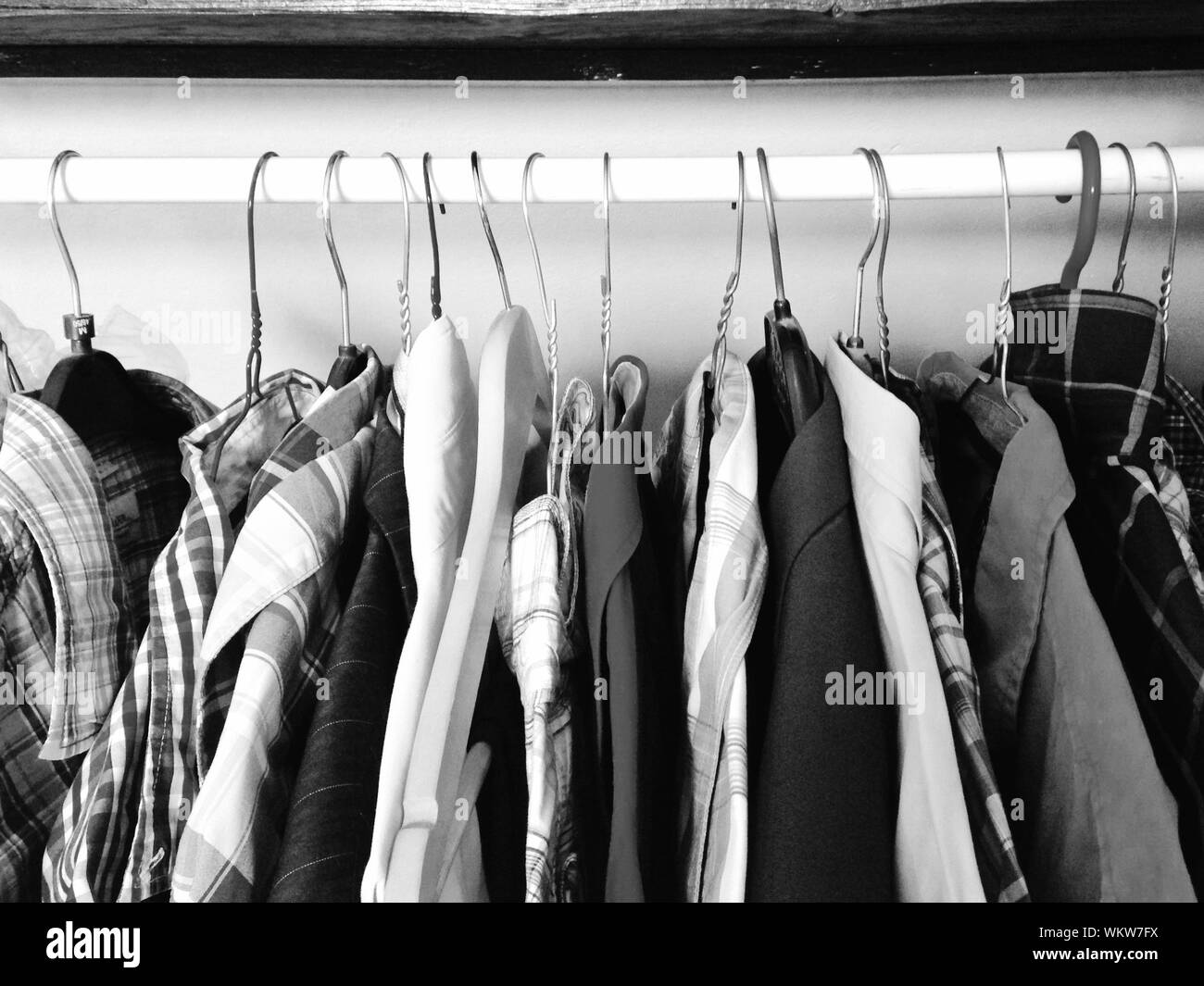 Menswear Clothes Hanging On Rack In Closet Stock Photo