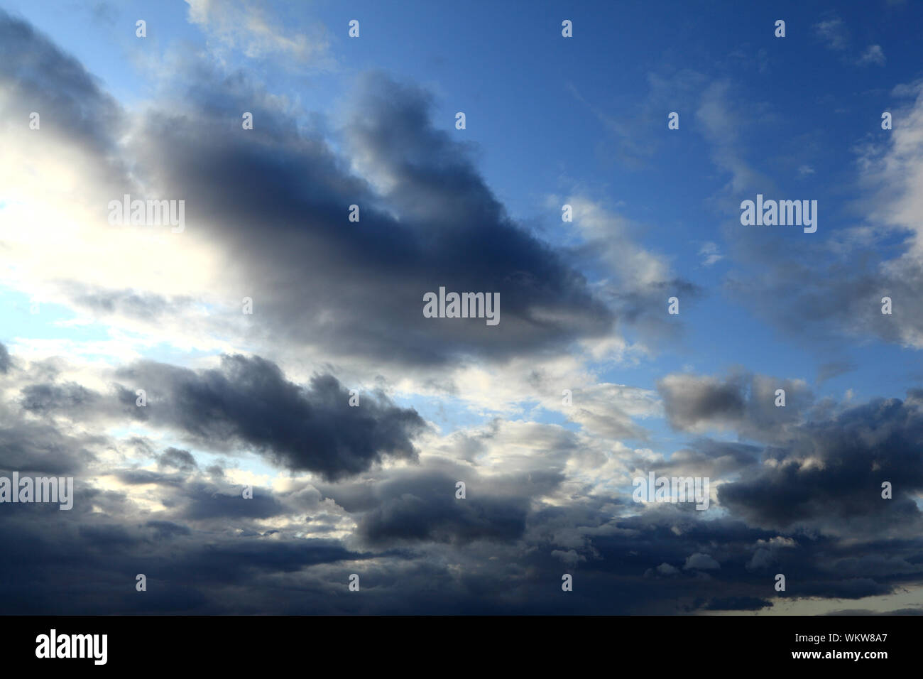 Rain clouds, approaching, grey, dark, white, cloud, blue sky, weather Stock Photo