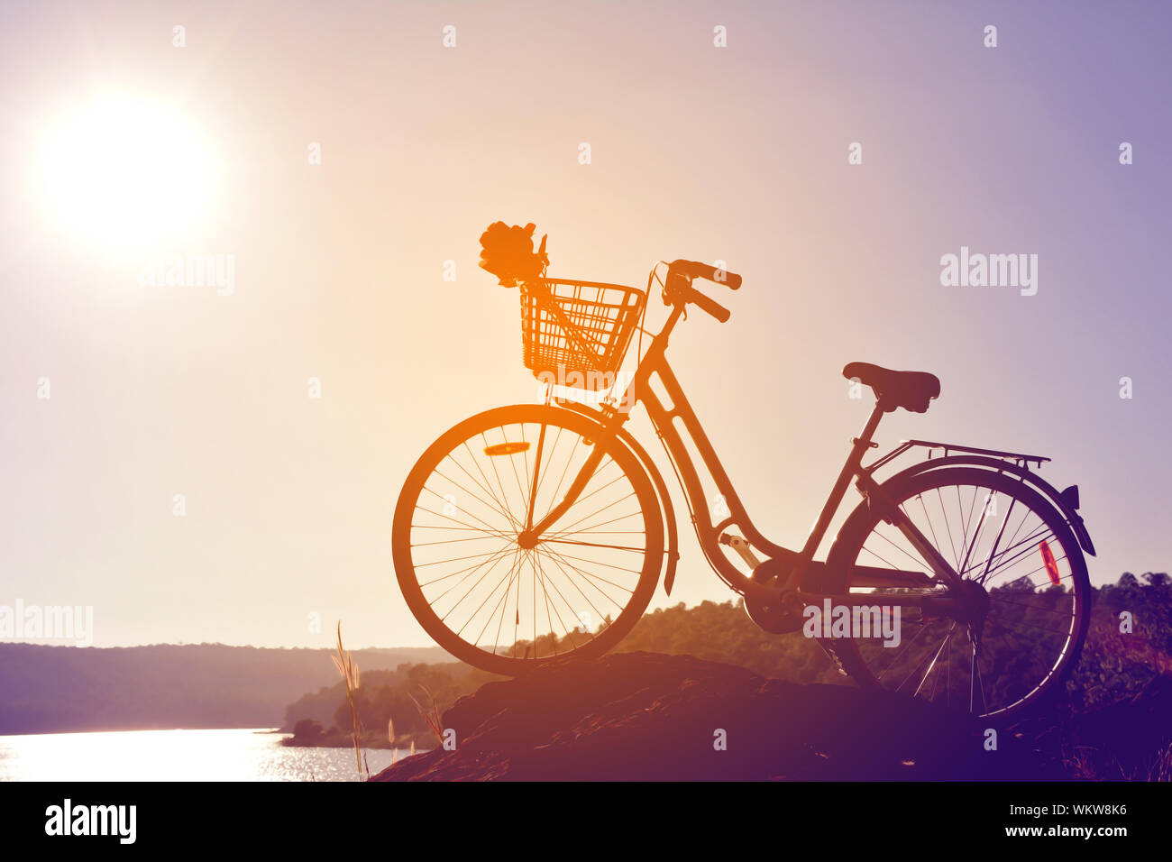 Bicycle Parked On Rock Against Sky Stock Photo