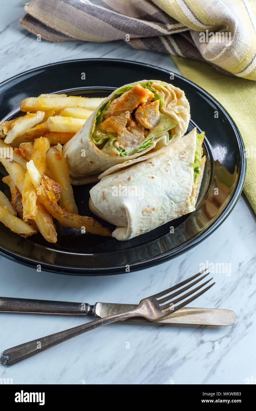 Grilled buffalo chicken sandwich wrap with romaine lettuce bleu cheese ...