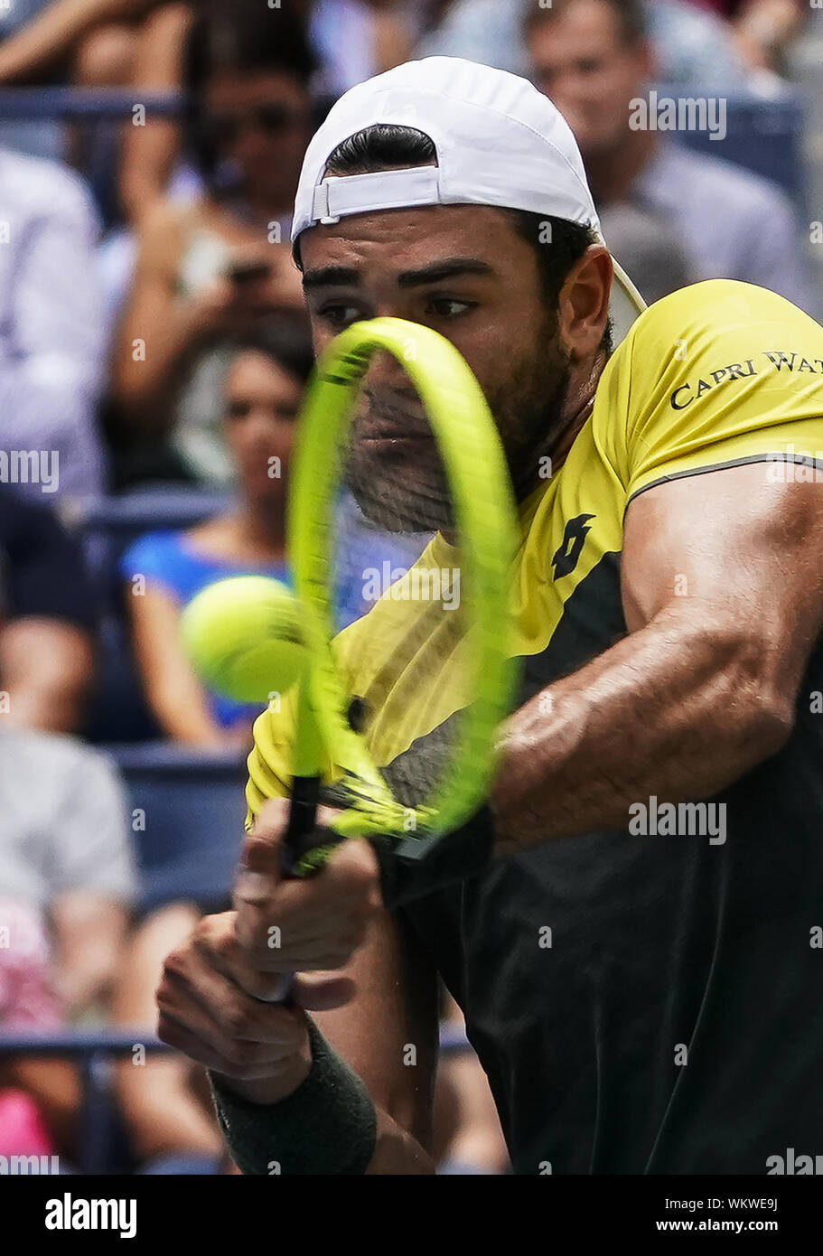 Matteo Berrettini, of Italy, returns to Gael Monfils, of France, during the quarterfinals of the U.S. Open tennis championships Wednesday, Sept
