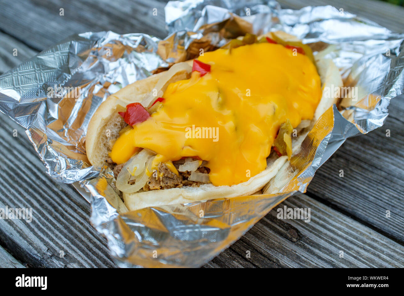 Messy Philly cheesesteak with melted cheese mushrooms onions and