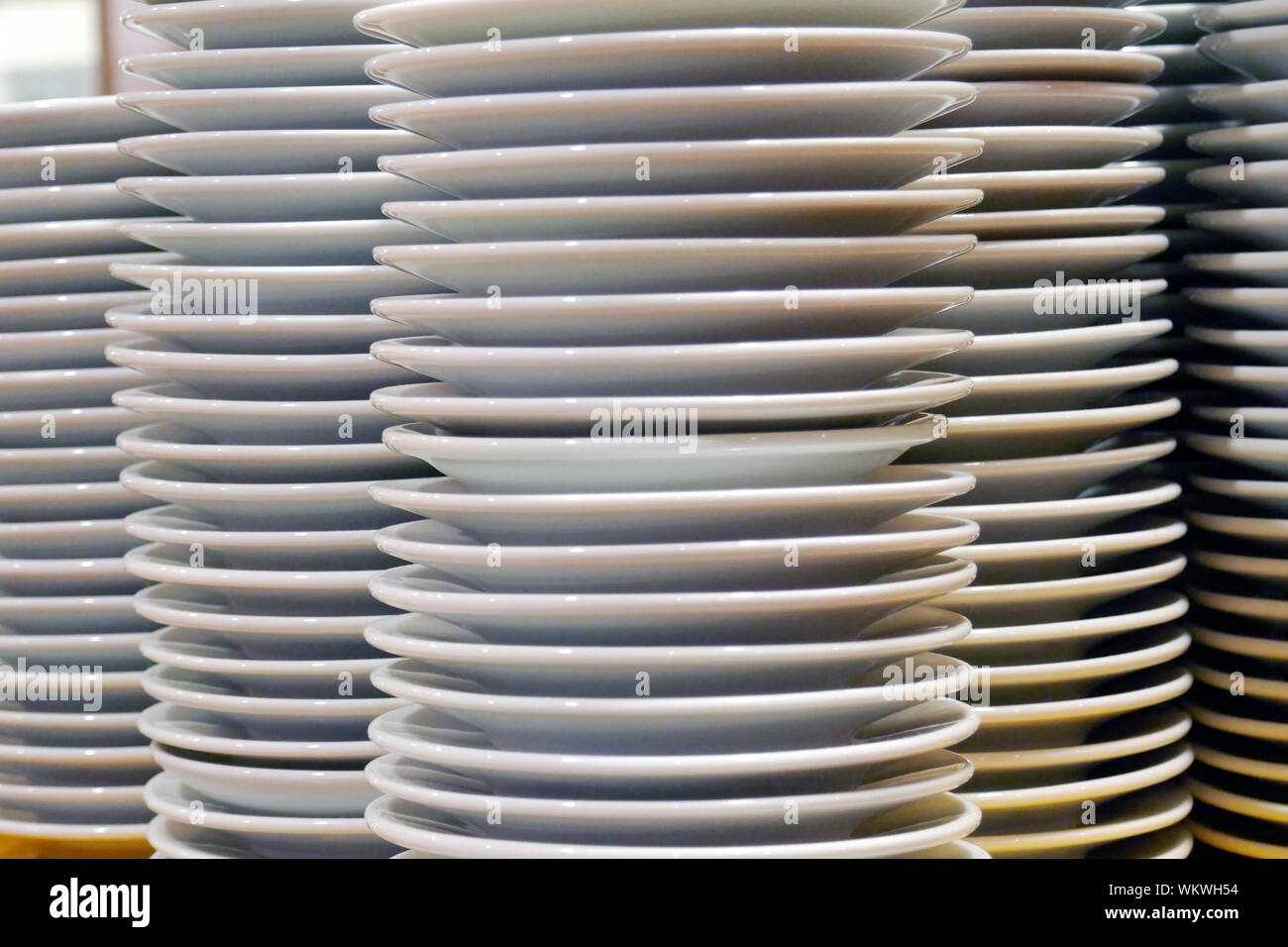 Stacked Plates On Table At Restaurant Stock Photo Alamy