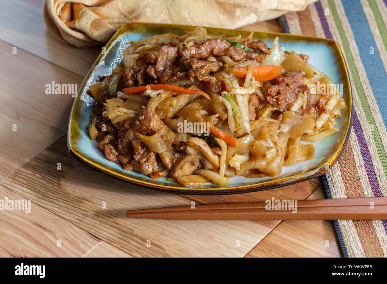 Stir fried Chinese beef chow fun with hor fun wide rice noodles cabbage