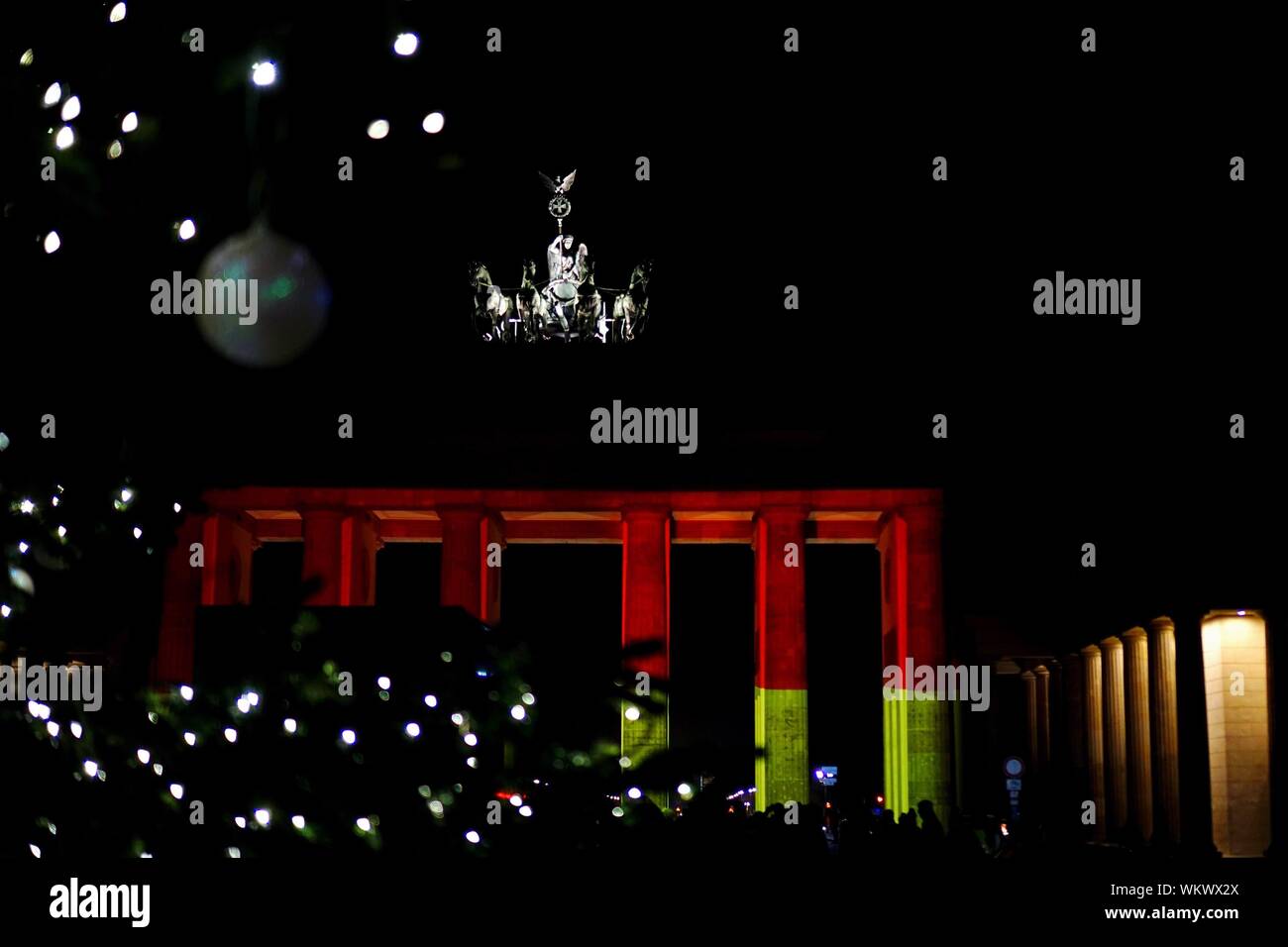Illuminated Christmas Lighting Decoration At Brandenburg Gate During Night Stock Photo