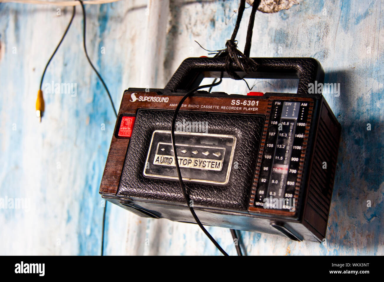 Retro radio with a cassette player hanging on the wall Stock Photo Alamy