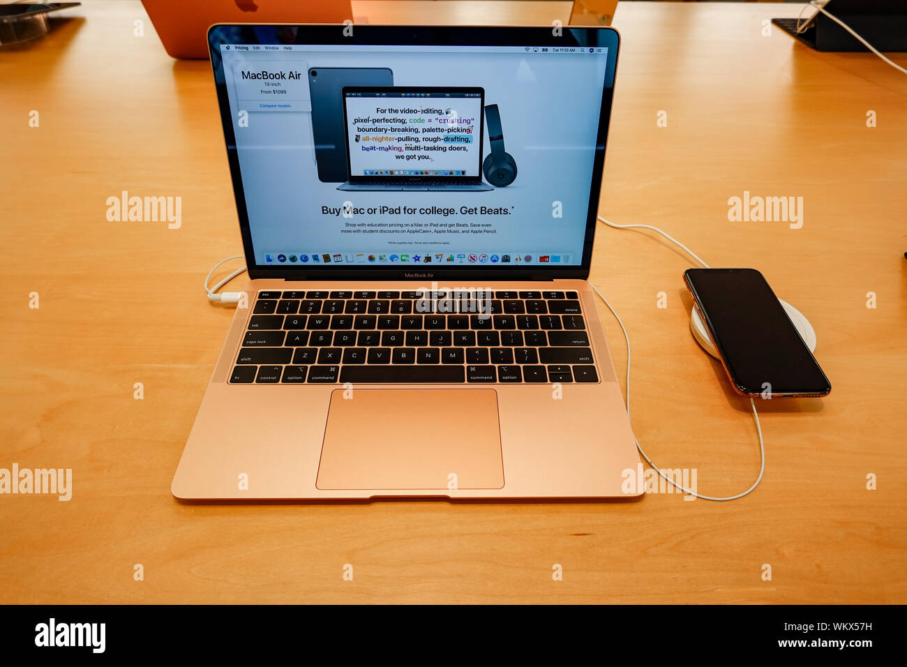 Orlando,FL/USA-8/27/19: An Apple MacBook Air with a paired Apple iPhone X. Stock Photo