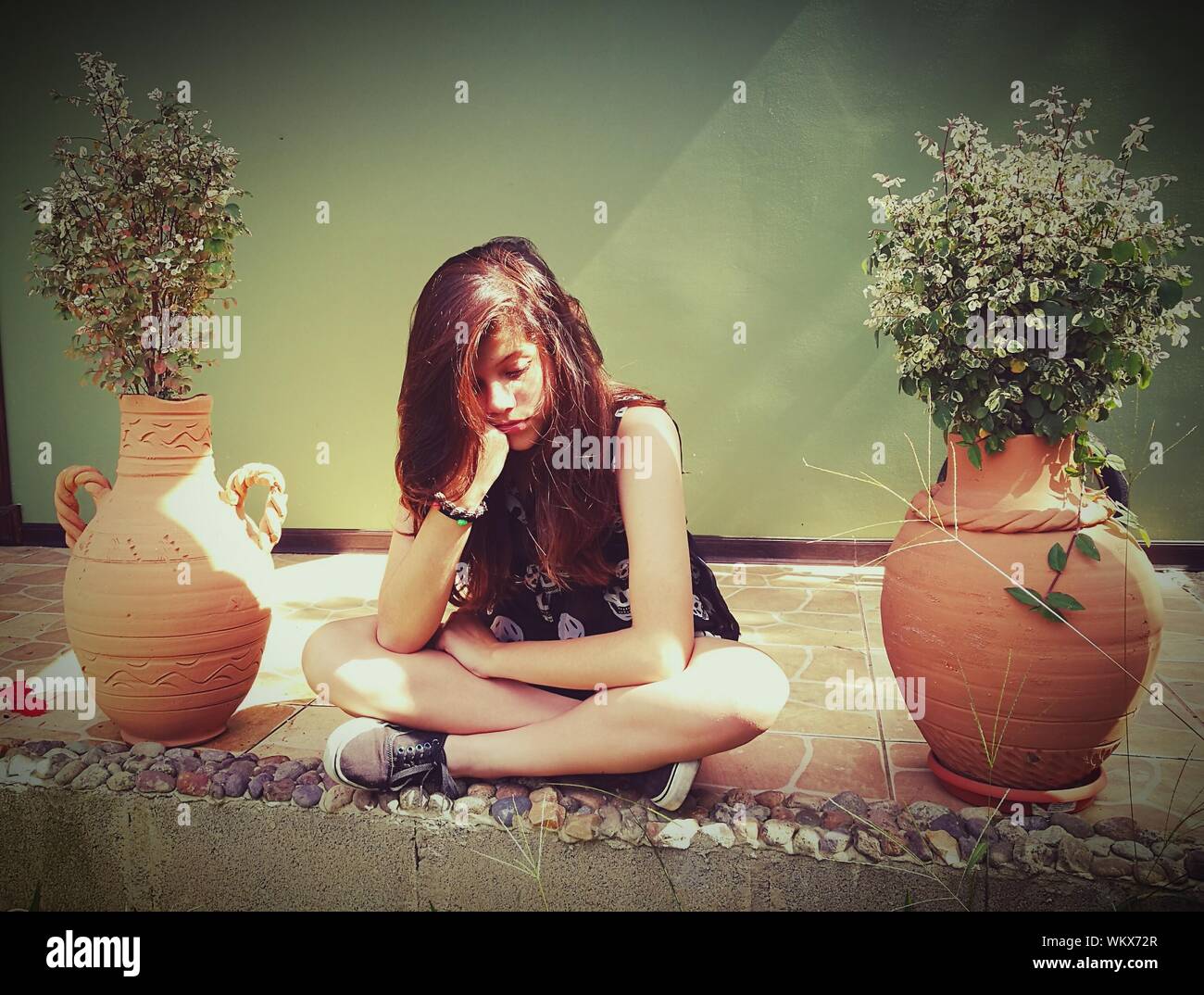 Girl Sad Sitting Floor High Resolution Stock Photography and Images - Alamy