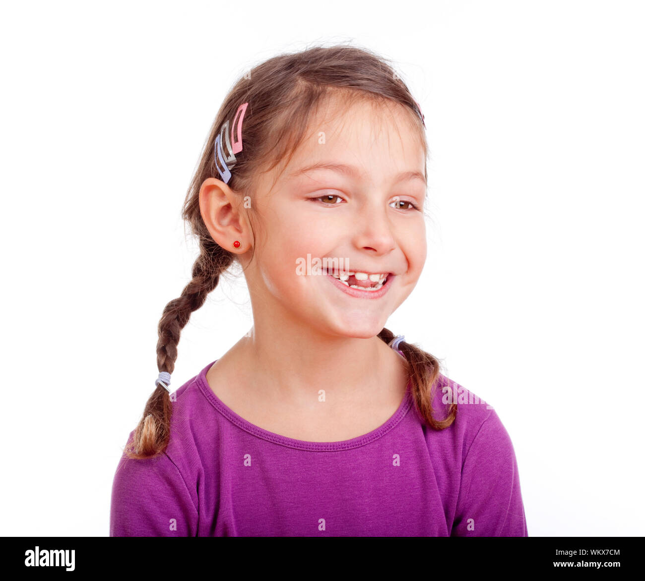 portrait of a little girl with braids smilig - isolated on white Stock ...