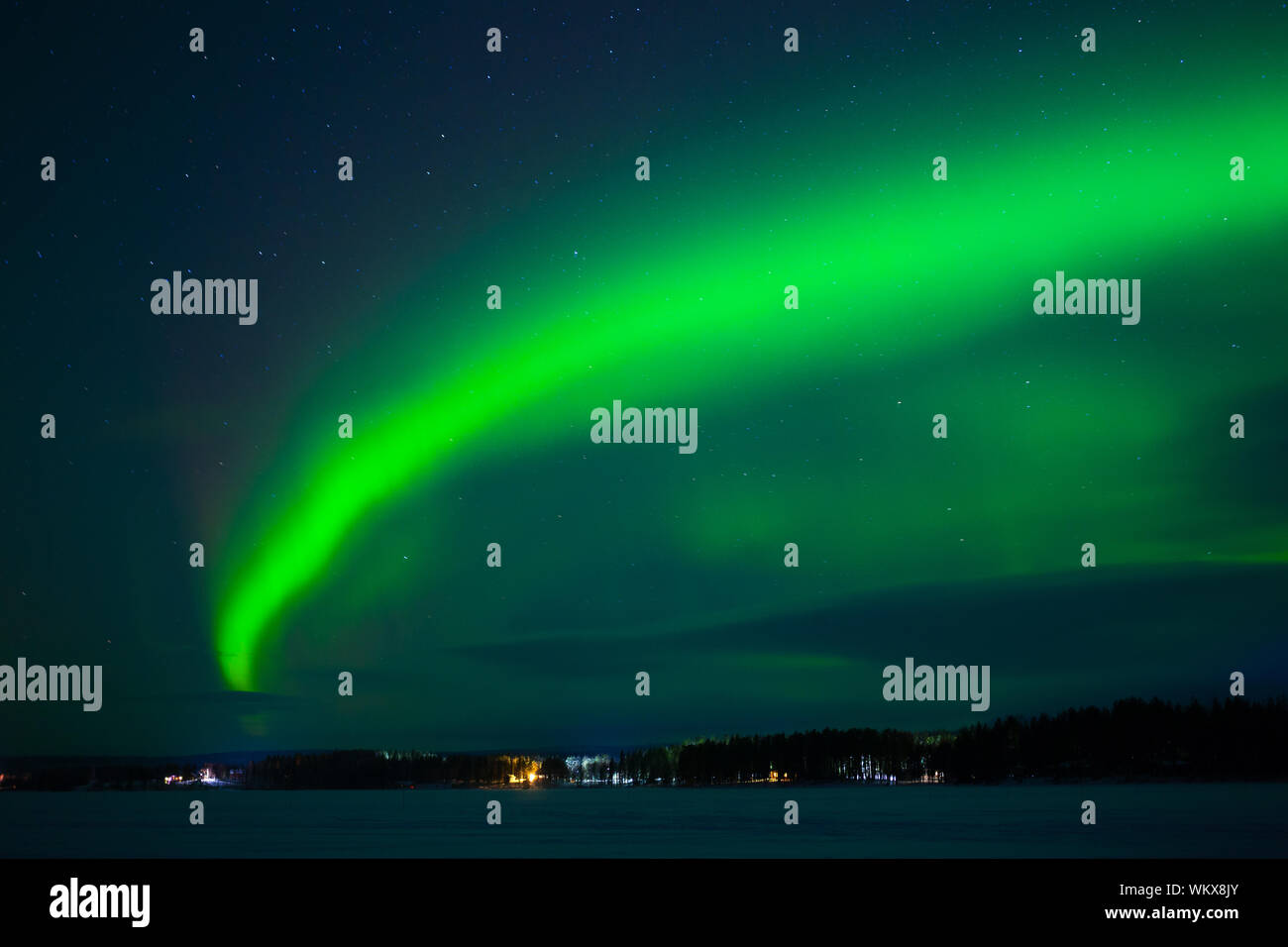 Intense northern lights - Aurora borealis over Lake in Finland Stock ...