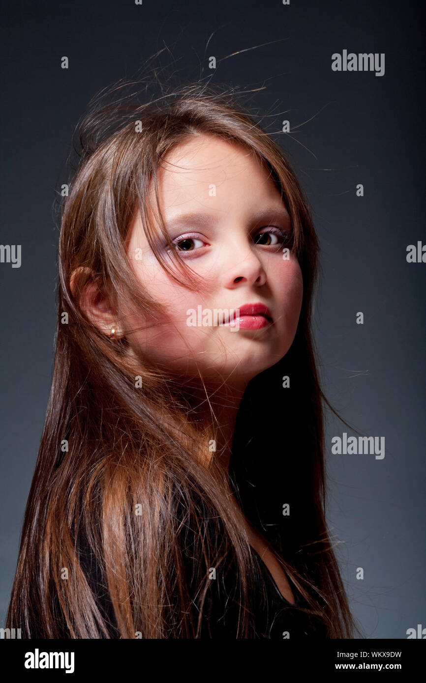portrait of a twelve years old girl with brown eyes and long hair Stock