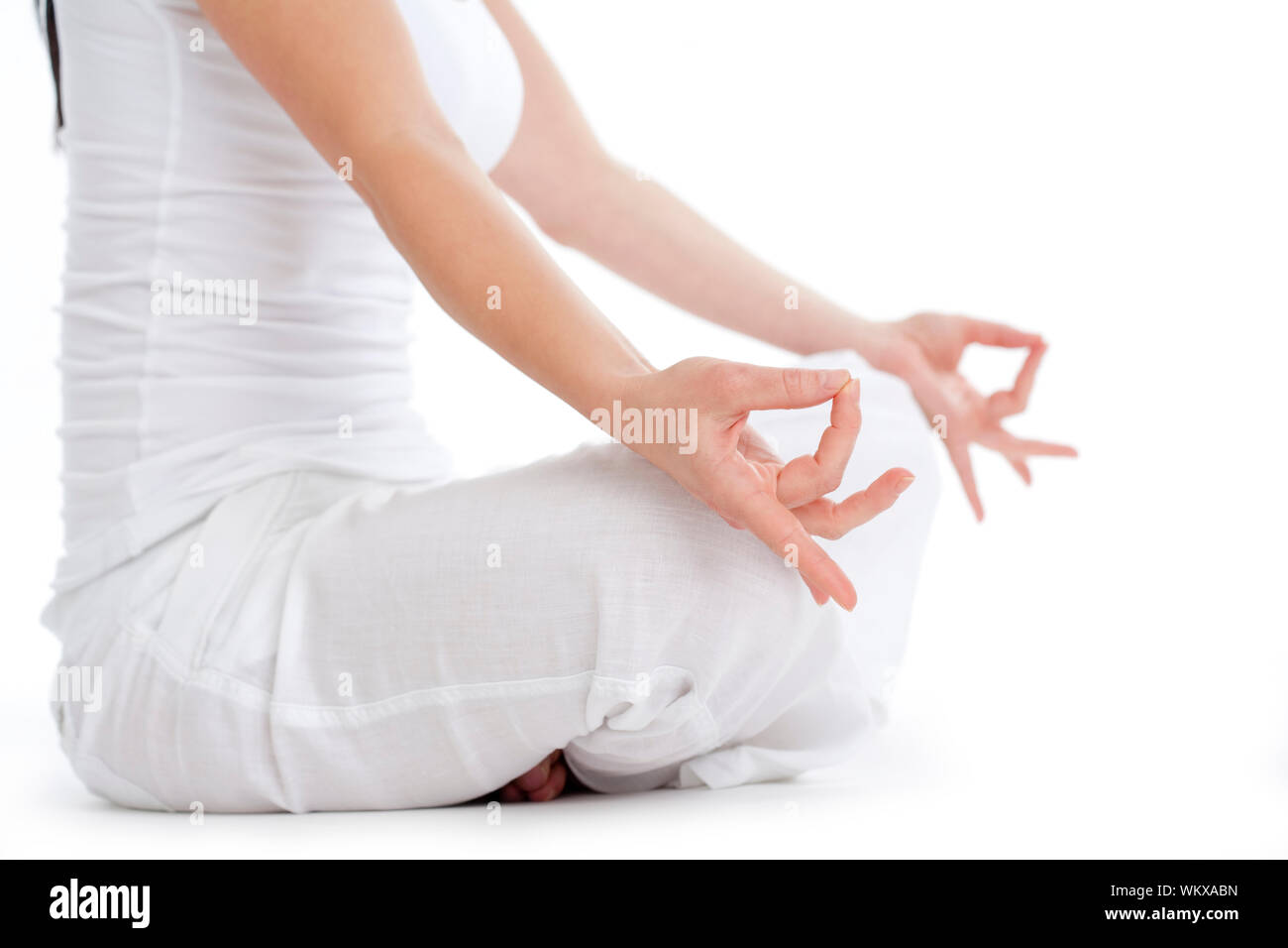 woman sitting on the floor exercising yoga - isolated on white Stock ...