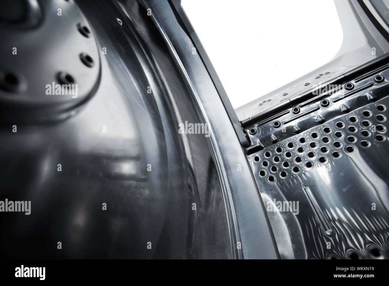 Interior view of a new european top loading washing machine. Very short depthoffield Stock