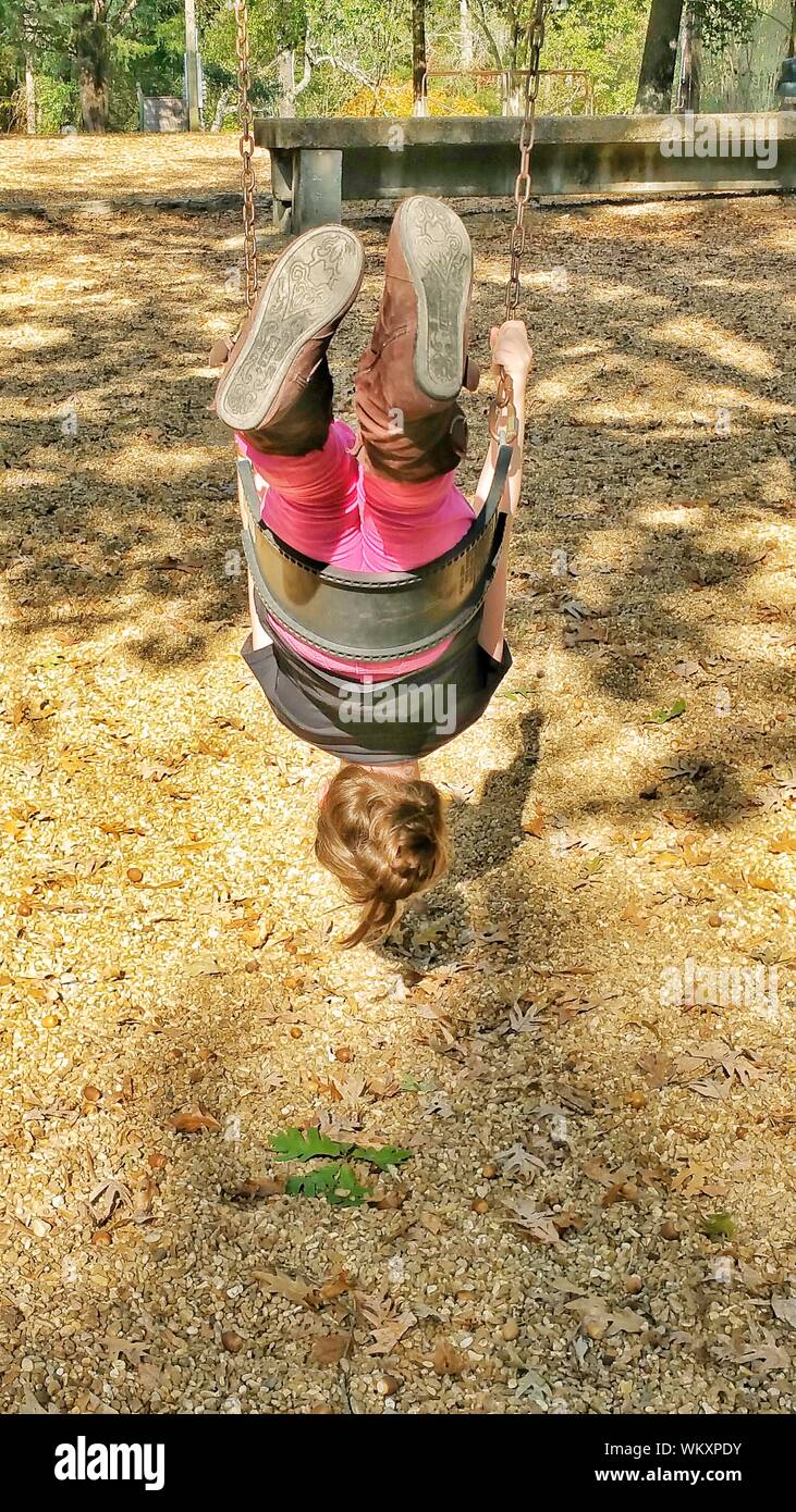 Girl upside down swing hires stock photography and images Alamy