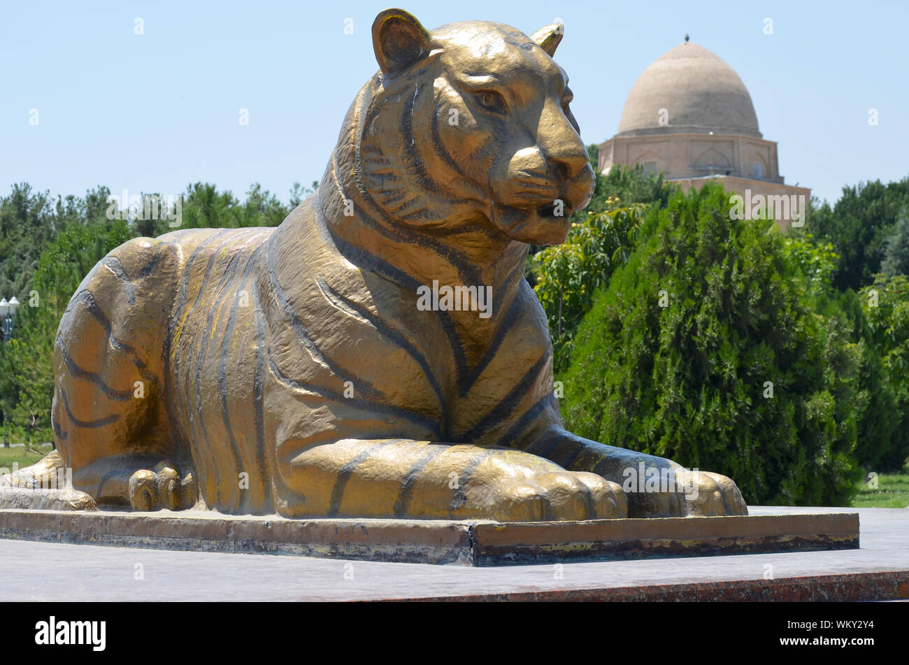 Golden guardian lion statues at the entrance of Amir Timur Park