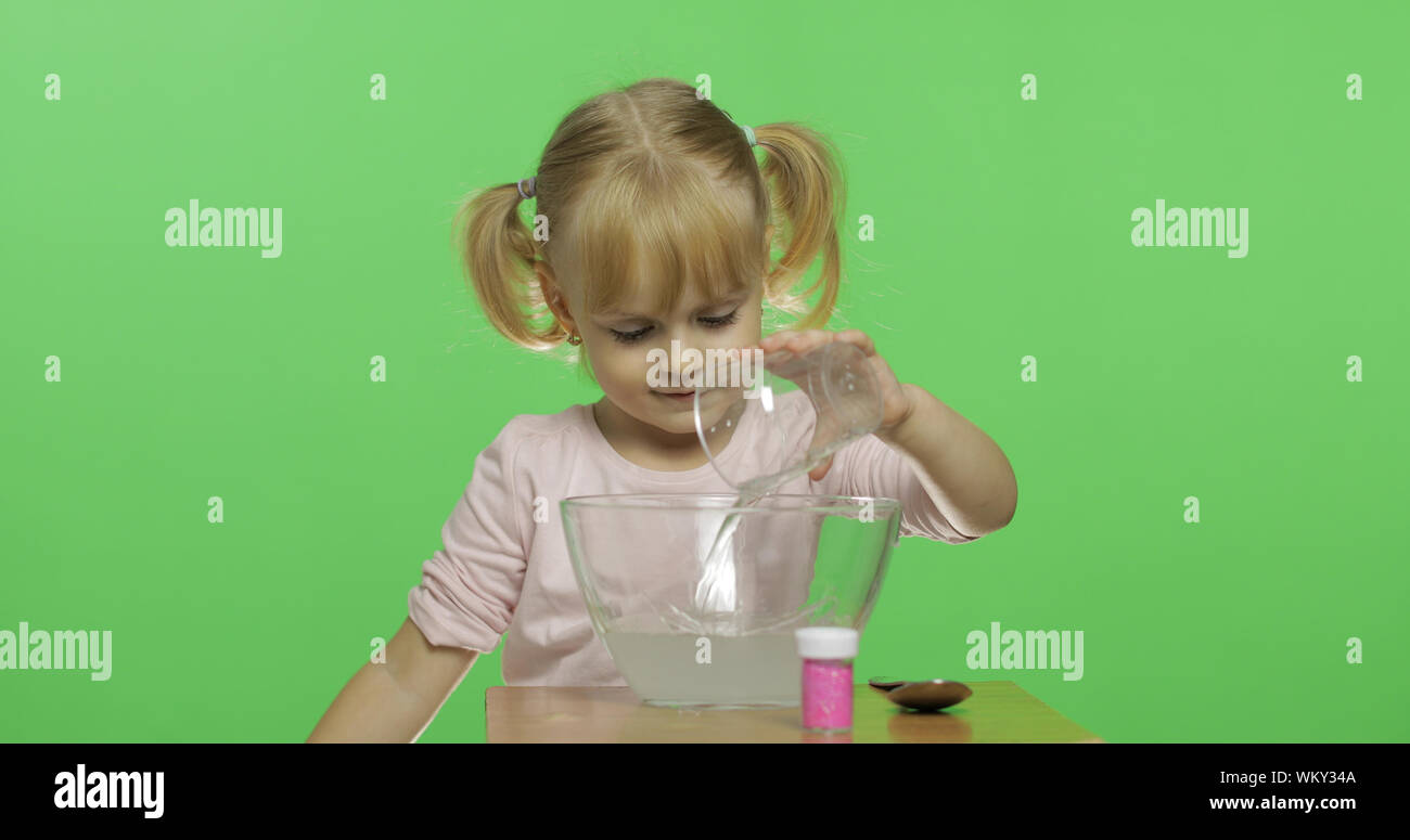 Child Having Fun Making Slime Mixes Ingredients Kid Playing With Hand Made Toy Slime Funny Kid Girl Oddly Satisfying Slime For Pure Fun And Stress Relief Dark Background Stock Photo Alamy