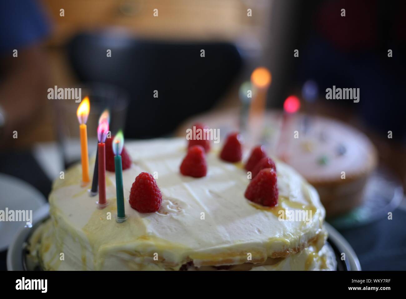 Lit Candles On Birthday Cakes At Home Stock Photo Alamy