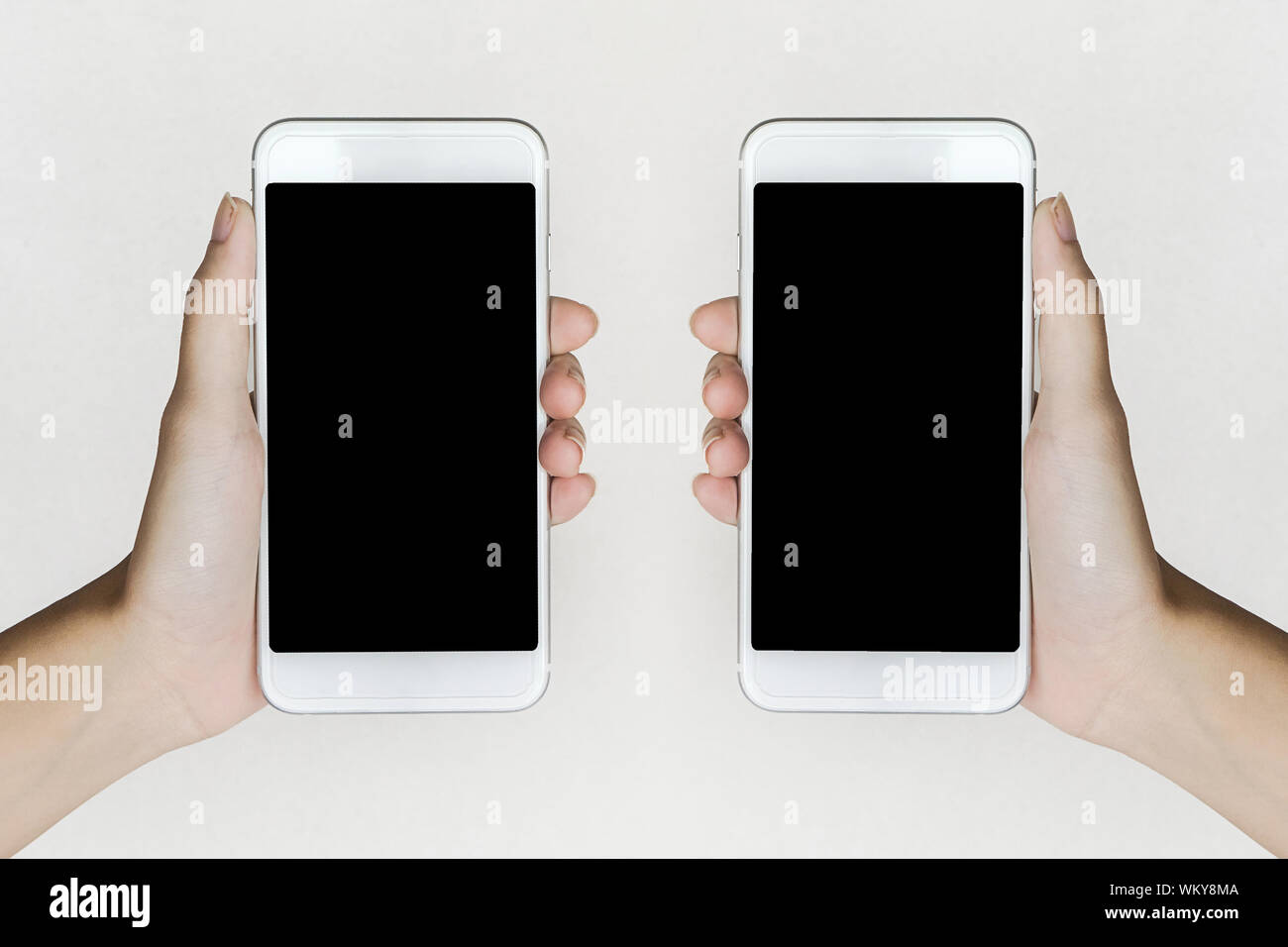 Holding phones hi-res stock photography and images - Alamy