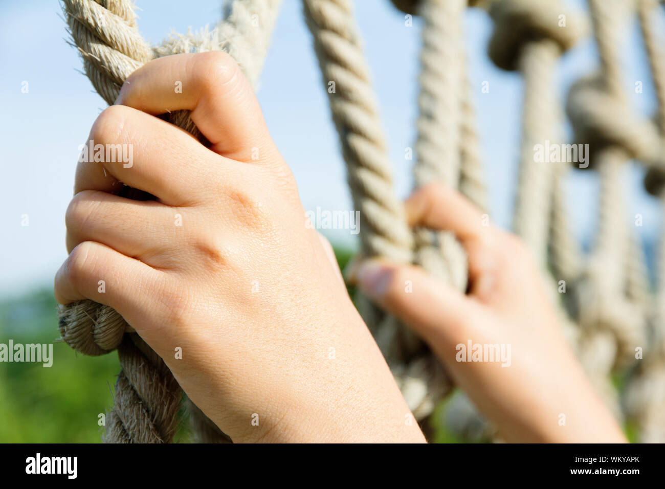 hand holding climbing ropes Stock Photo