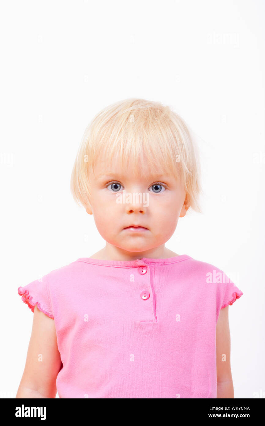 Portrait Of A Little Girl With Blond Hair And Blue Eyes Isolated