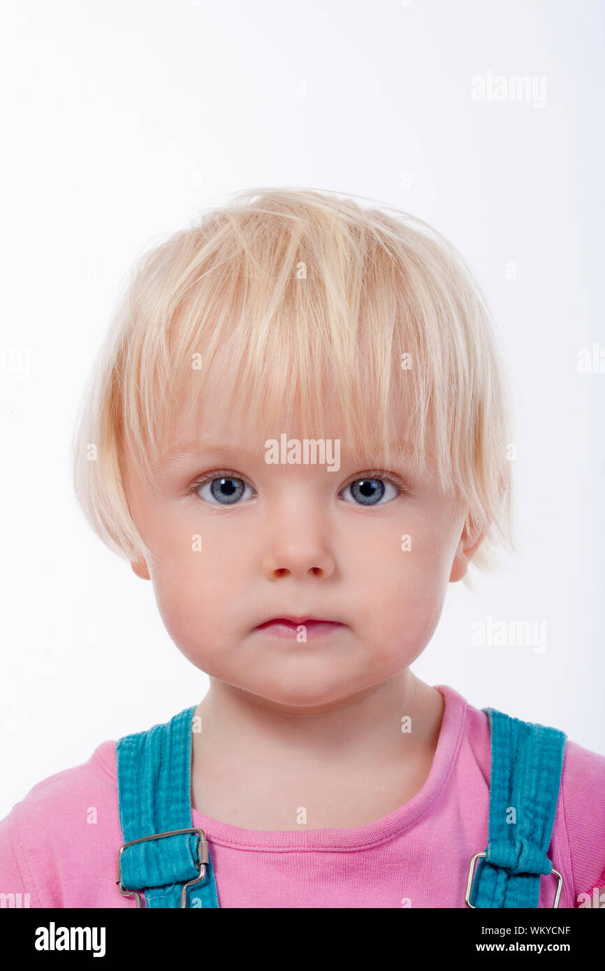 portrait of a little girl with blond hair and blue eyes - isolated on ...