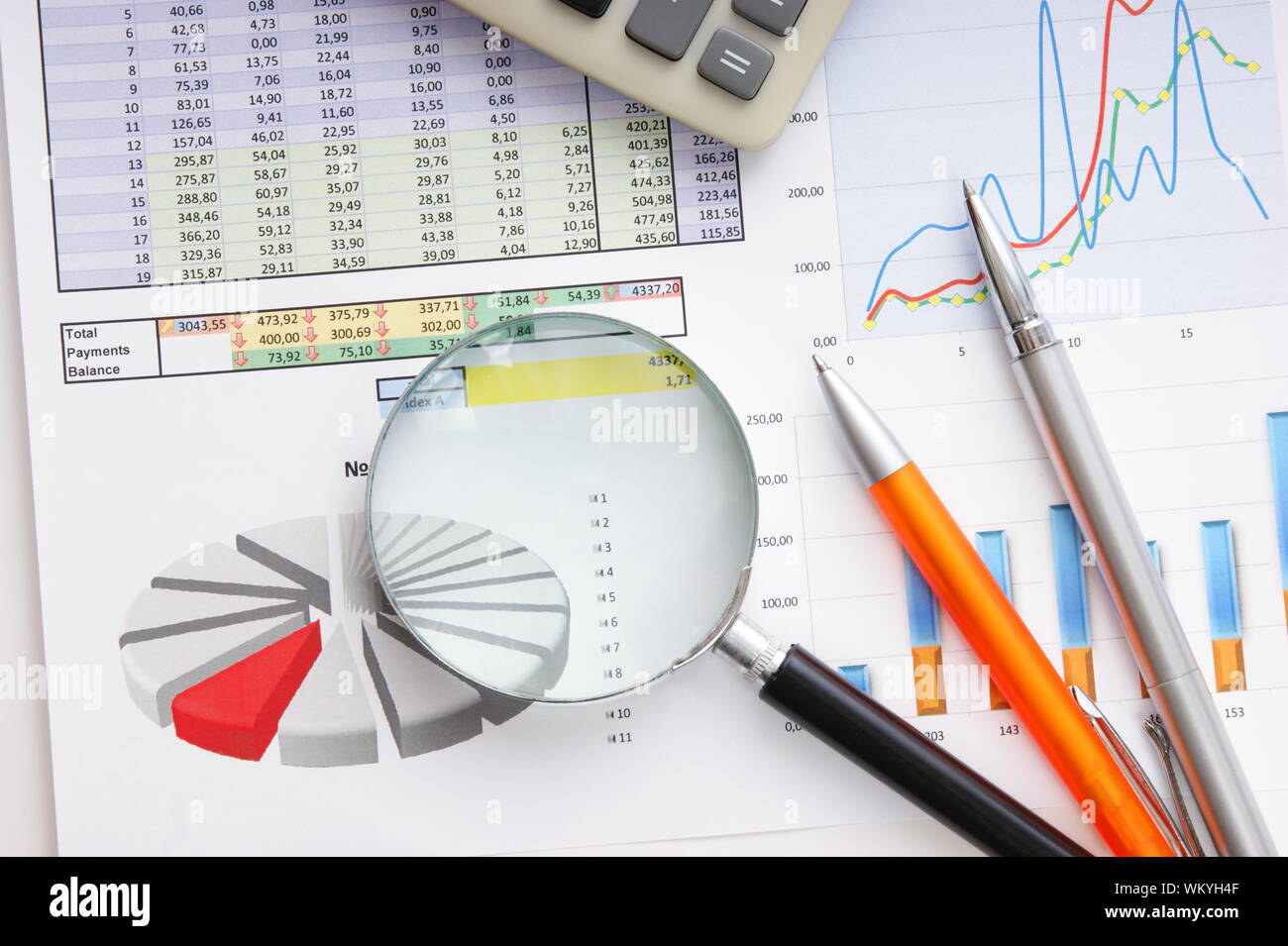 Graphs tables and documents laid on the table Stock Photo