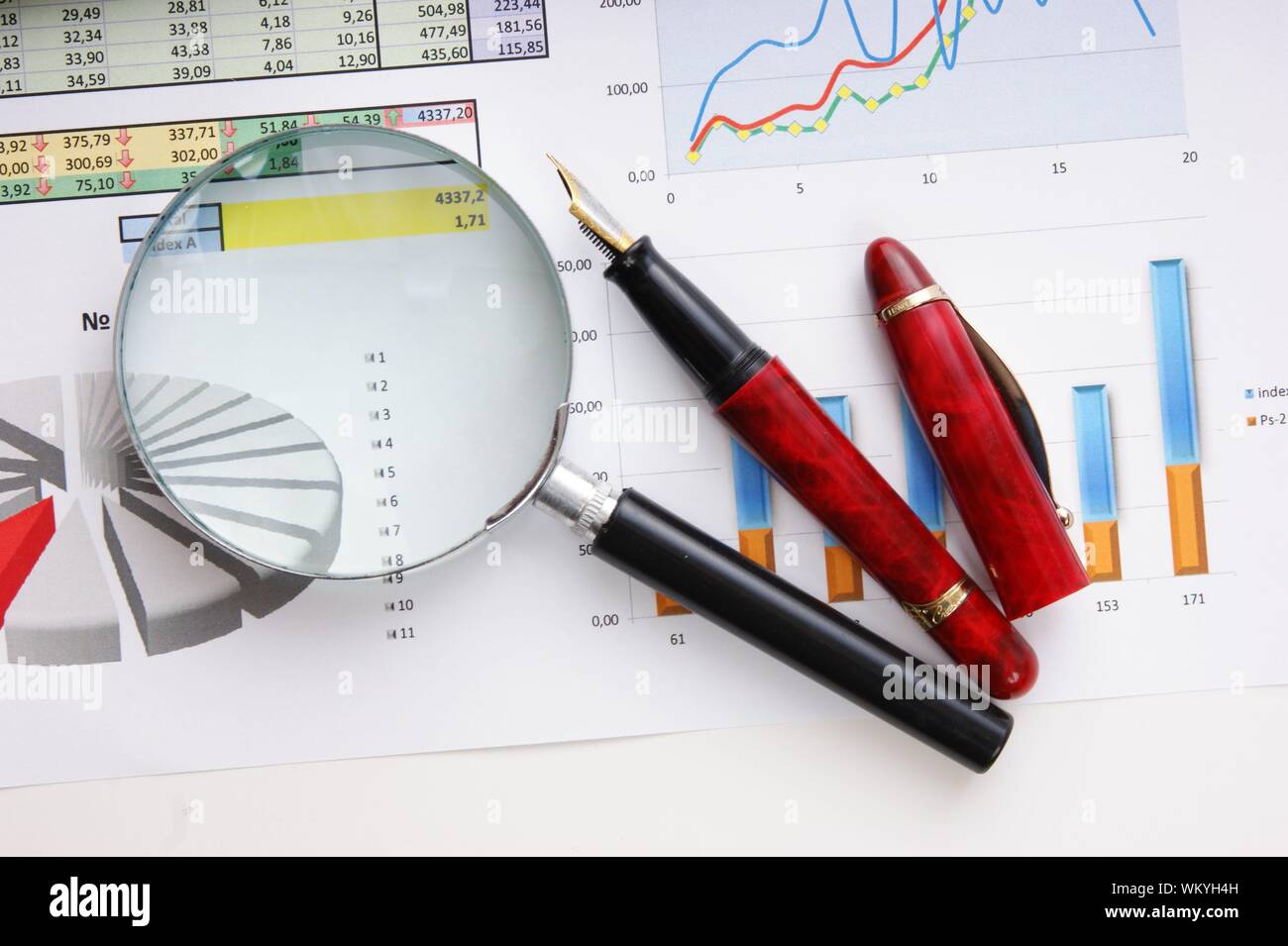 Graphs tables and documents laid on the table Stock Photo