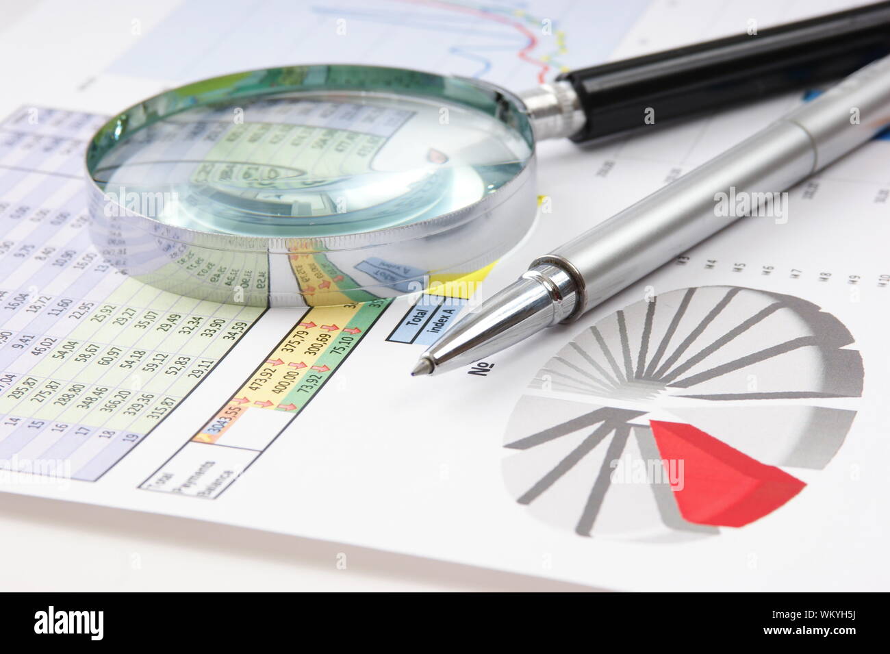 Graphs tables and documents laid on the table Stock Photo