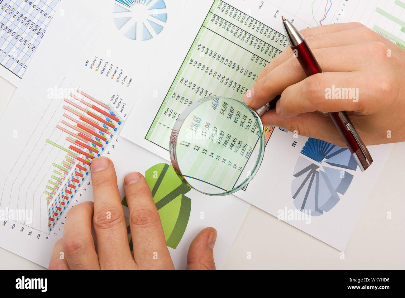 Graphs tables and documents laid on the table Stock Photo