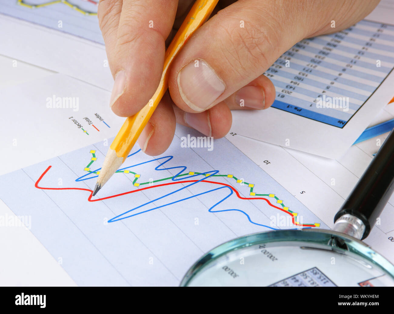 Graphs tables and documents laid on the table Stock Photo