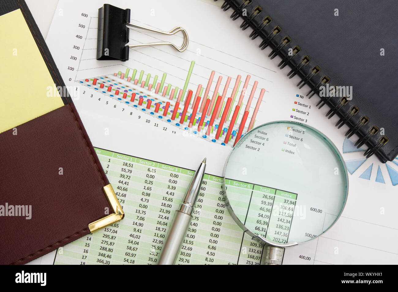 Graphs tables and documents laid on the table Stock Photo