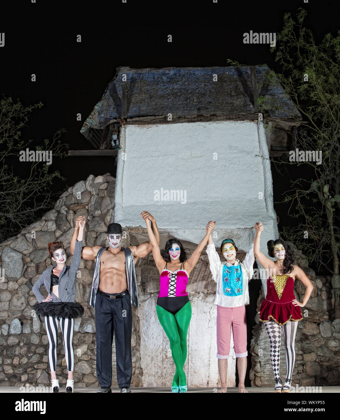Group of celebrating cirque performers on stage Stock Photo Alamy