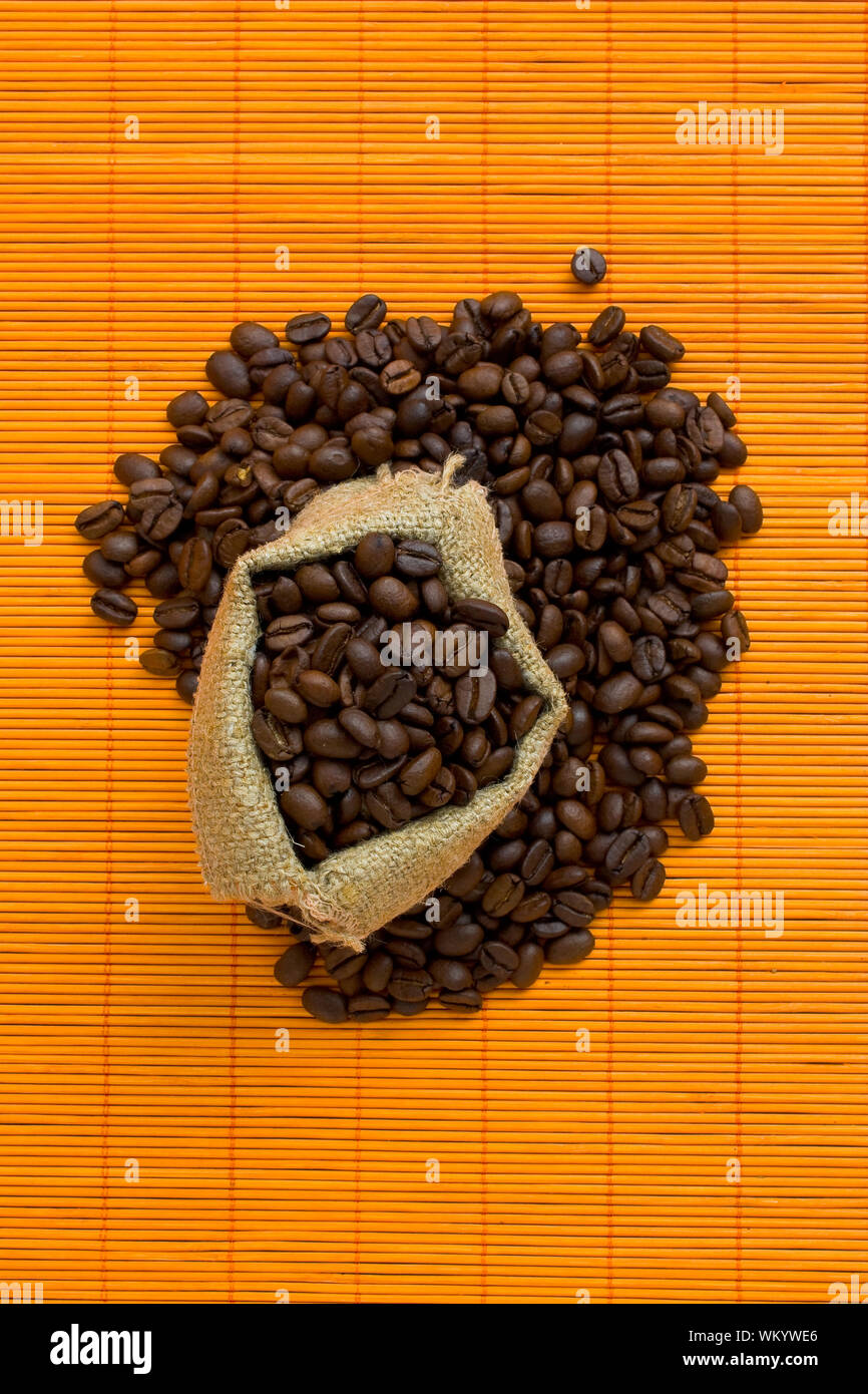 Coffee beans spilled out of the bag Stock Photo - Alamy