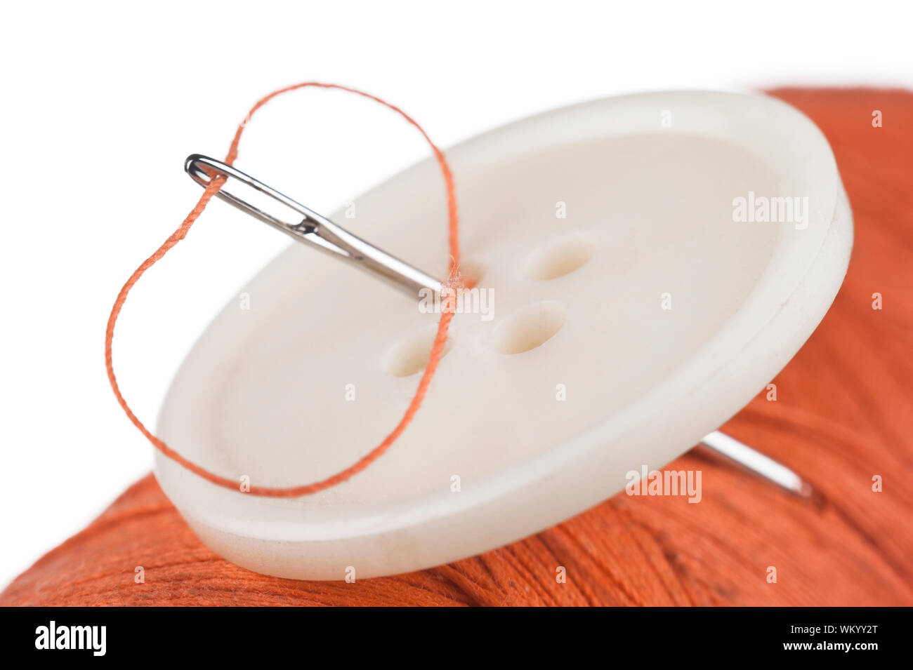 Button pinned the needle to the reel of thread Stock Photo - Alamy