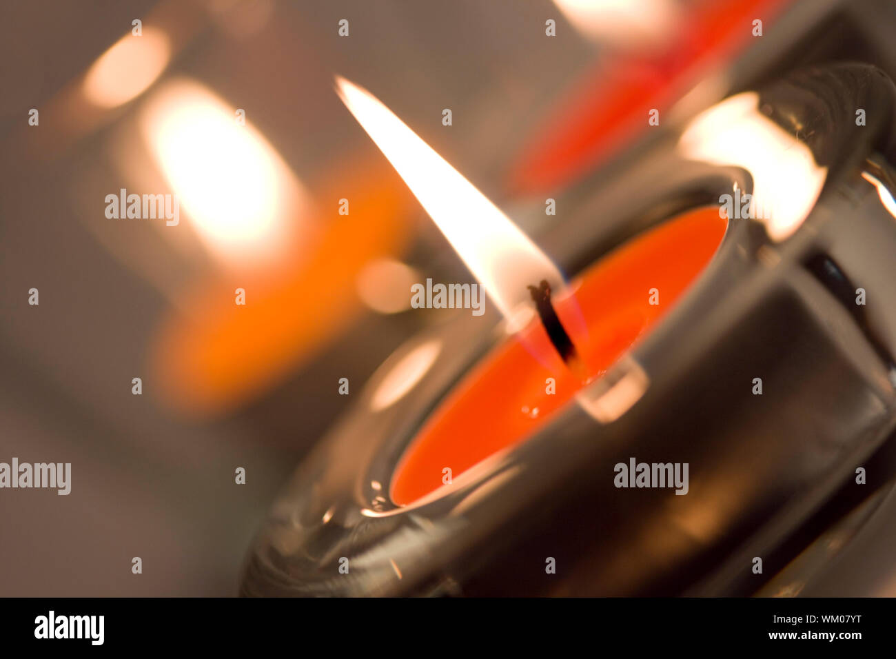 three candles flaming closeup Stock Photo Alamy
