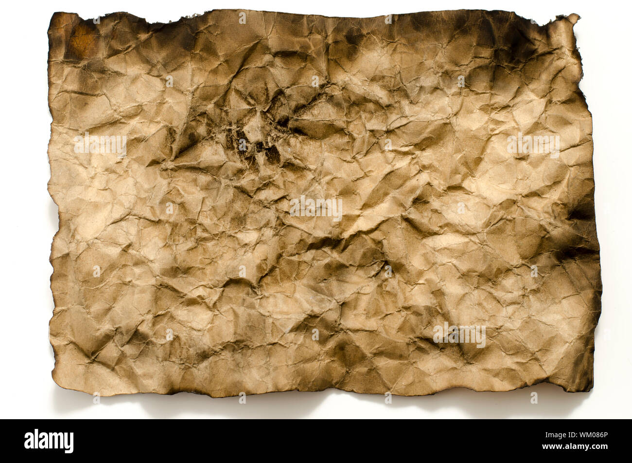 old crumpled paper burn on a white background Stock Photo - Alamy