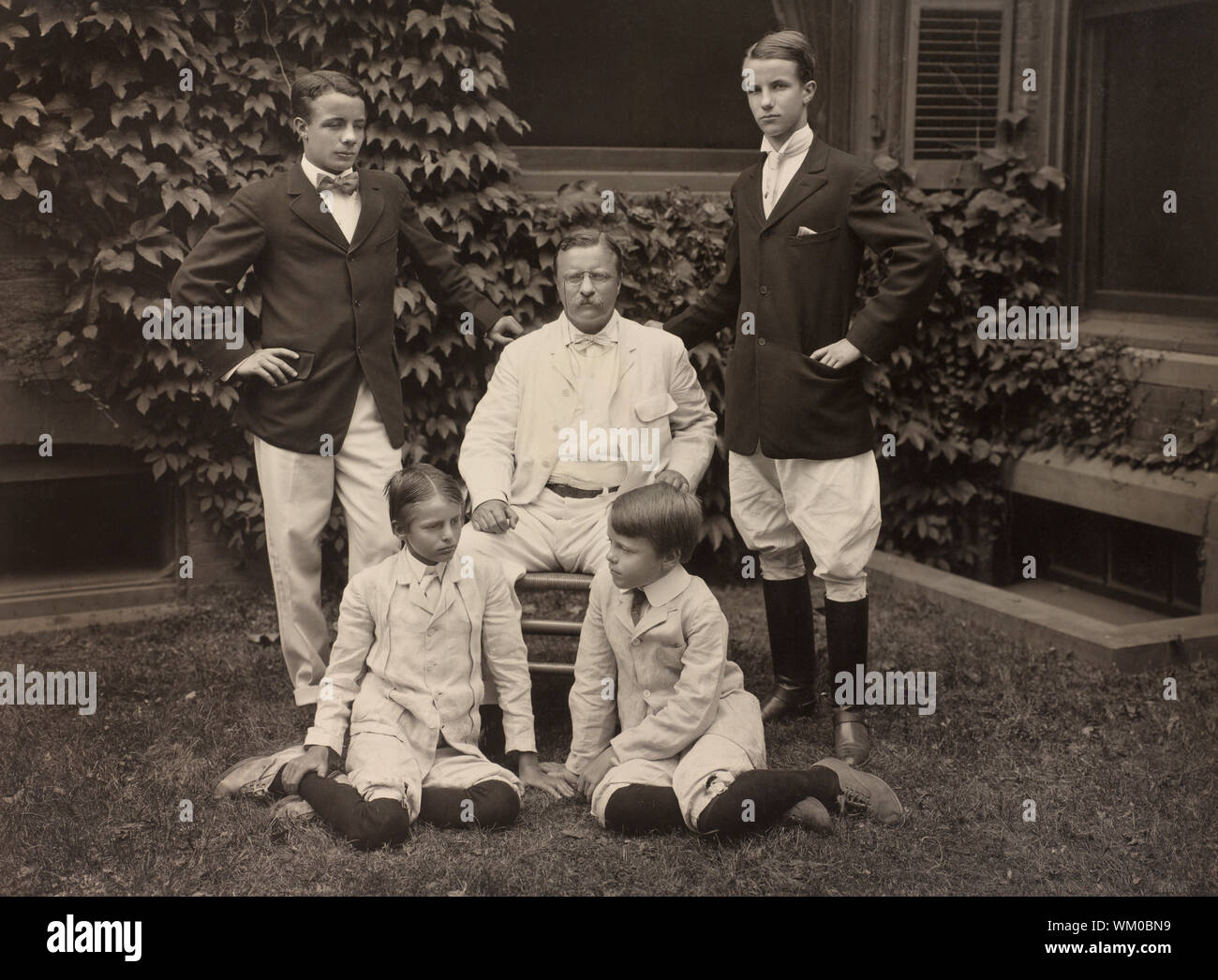 U.S. President Theodore Roosevelt Surrounded by his Four Sons, Full-length Portrait, Photograph by Pach Bros., 1907 Stock Photo