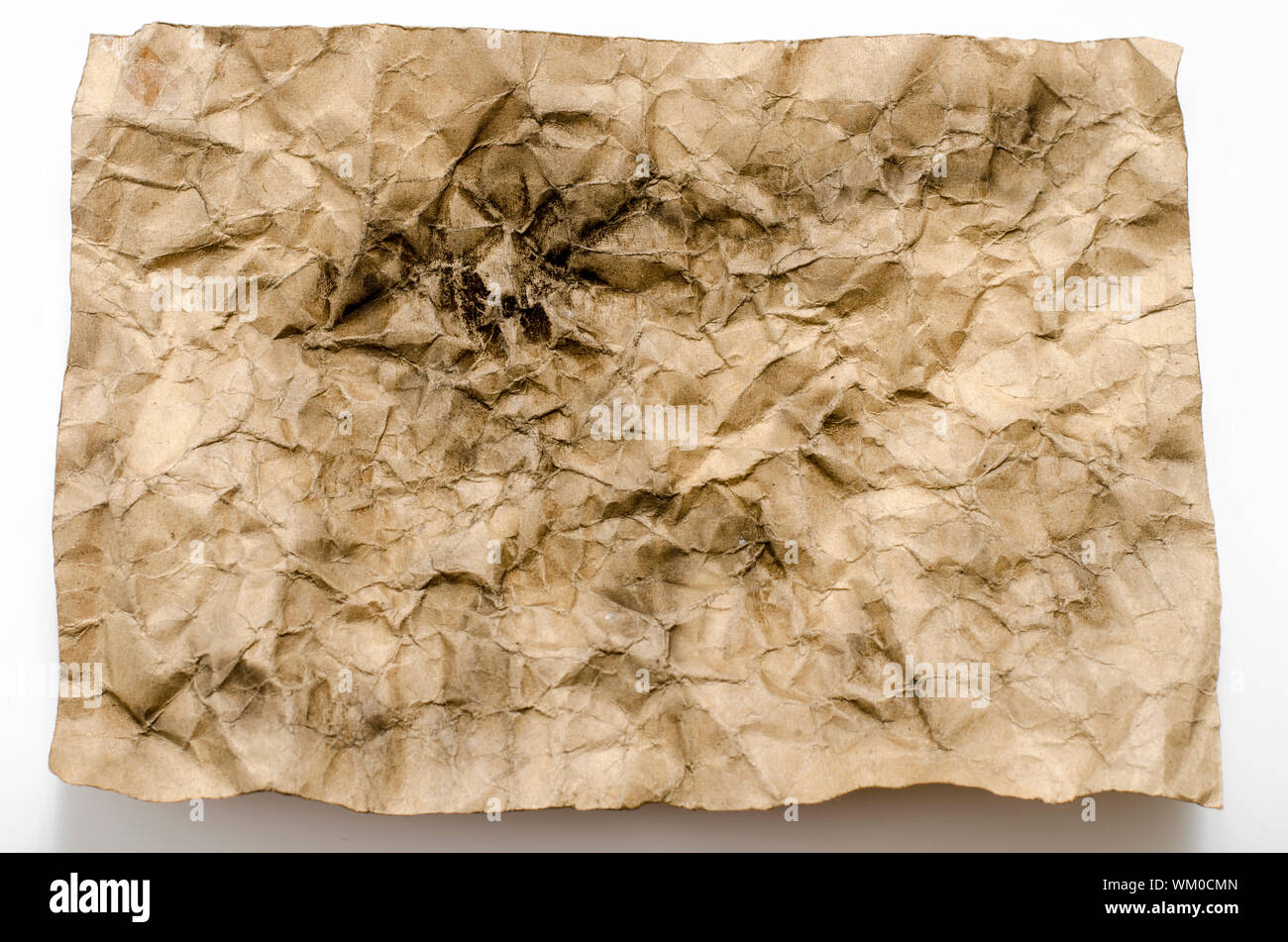 old crumpled paper burn on a white background Stock Photo - Alamy