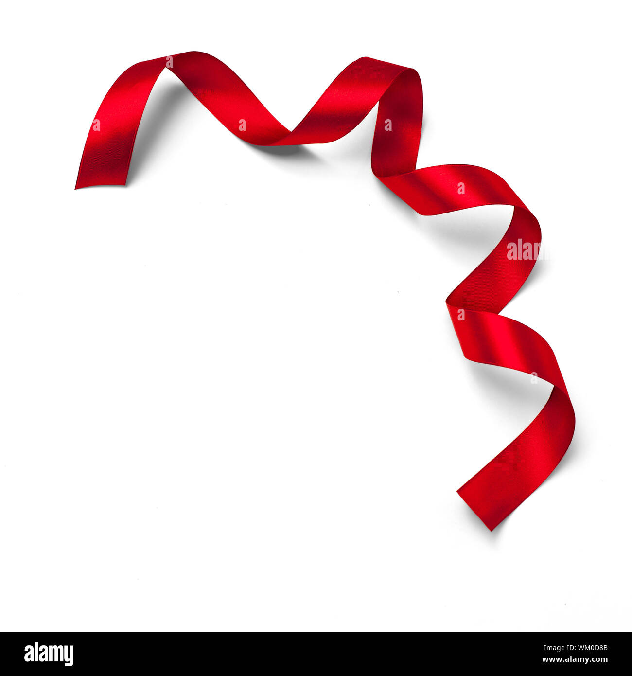 Shiny red satin ribbon on white background Stock Photo - Alamy