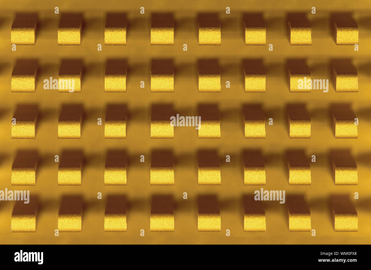 Macrophoto of a small golden metal radiator Stock Photo Alamy