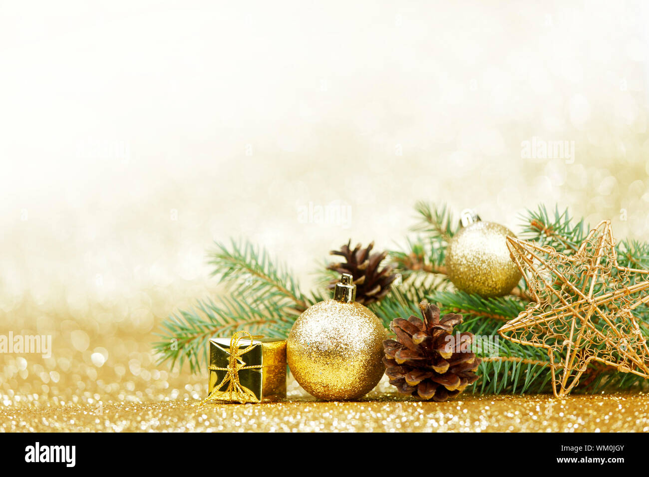 Christmas card with fir and decor on glitter background Stock Photo - Alamy