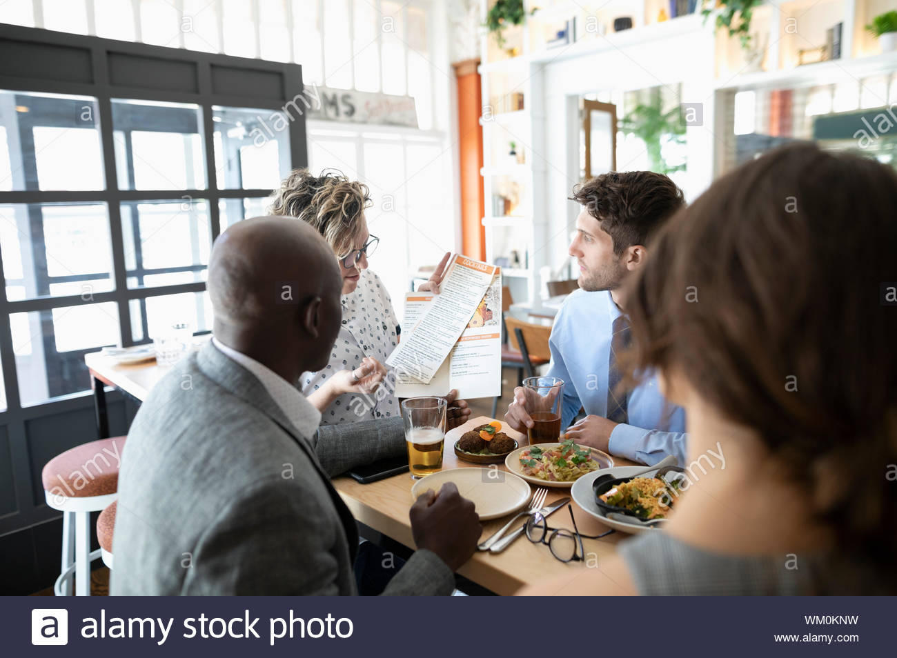 Business colleagues ordering lunch in restaurant Stock Photo Alamy