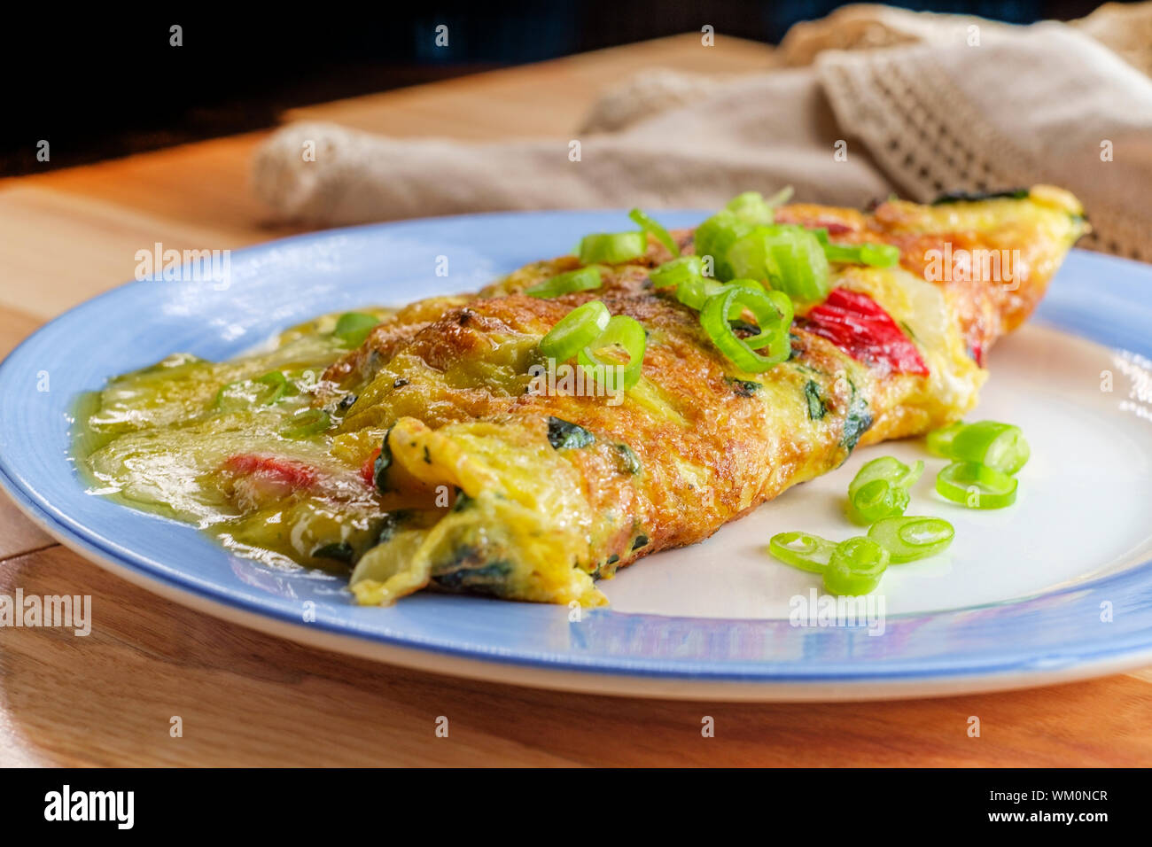 Spanish breakfast omelette filled with cheese spinach onions and