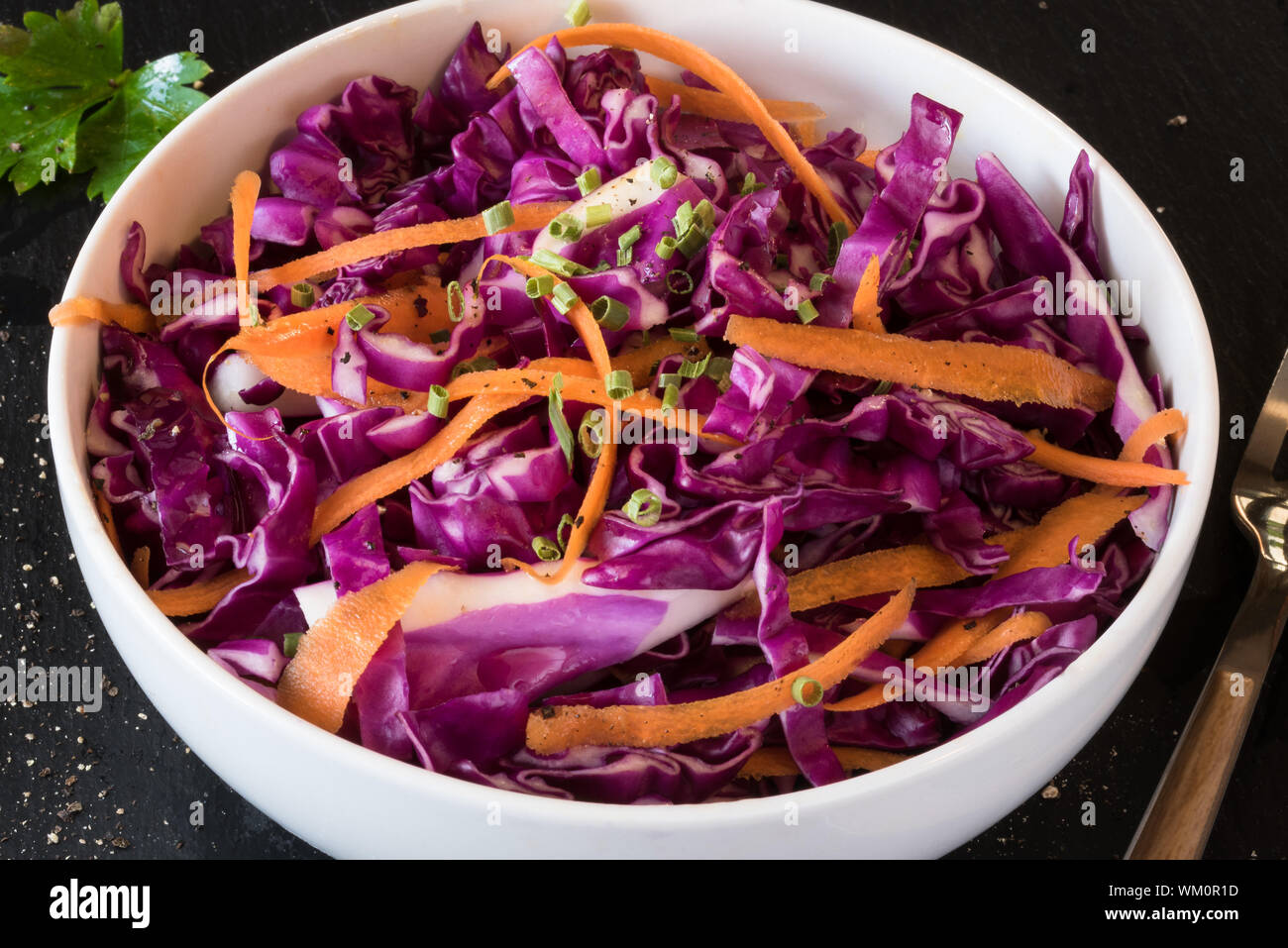 Close-up Of Red Cabbage Coleslaw In Bowl On Table Stock Photo
