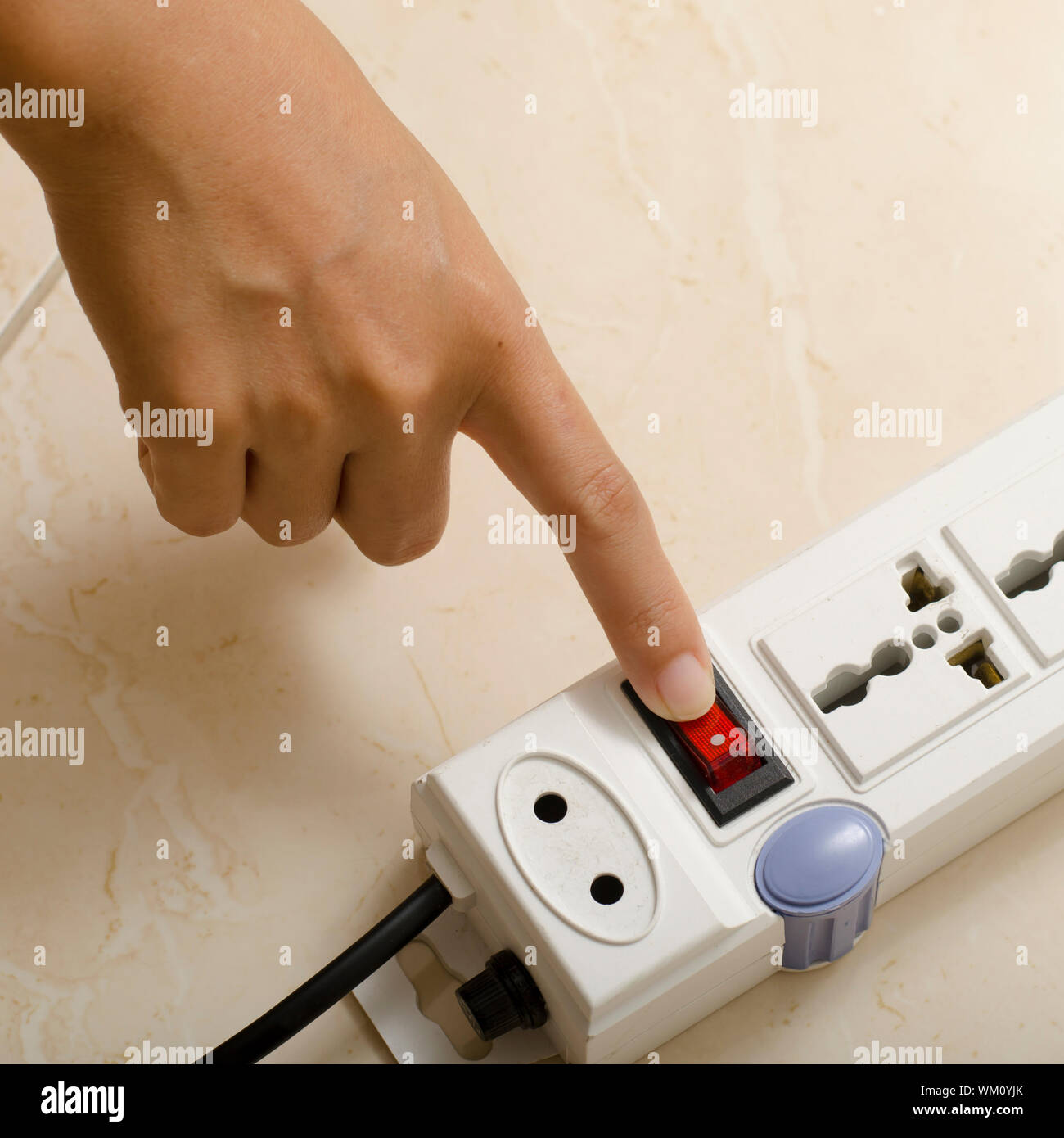hand turn on switch multiple socket plug Stock Photo Alamy